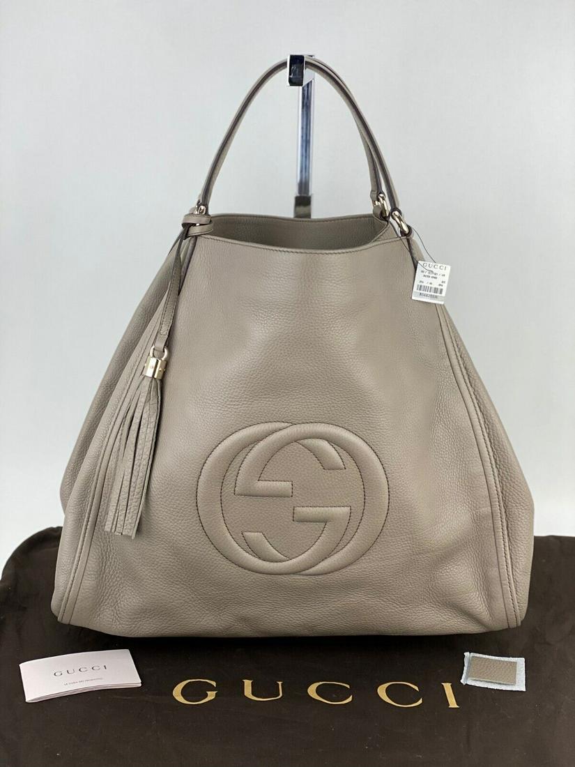 Gucci Tote Pebbled Calfskin XLarge Taupe Soho Shoulder Bag Tassel Weekender B271: SKU B271 0121 Gucci SOHO Top Handle X Large Pebbled calfskin Tote This Gucci bag can hold a lot with its big open compartment use it as a weekender or great to carry on plane NEW 100% AUTHENTIC CONDIT