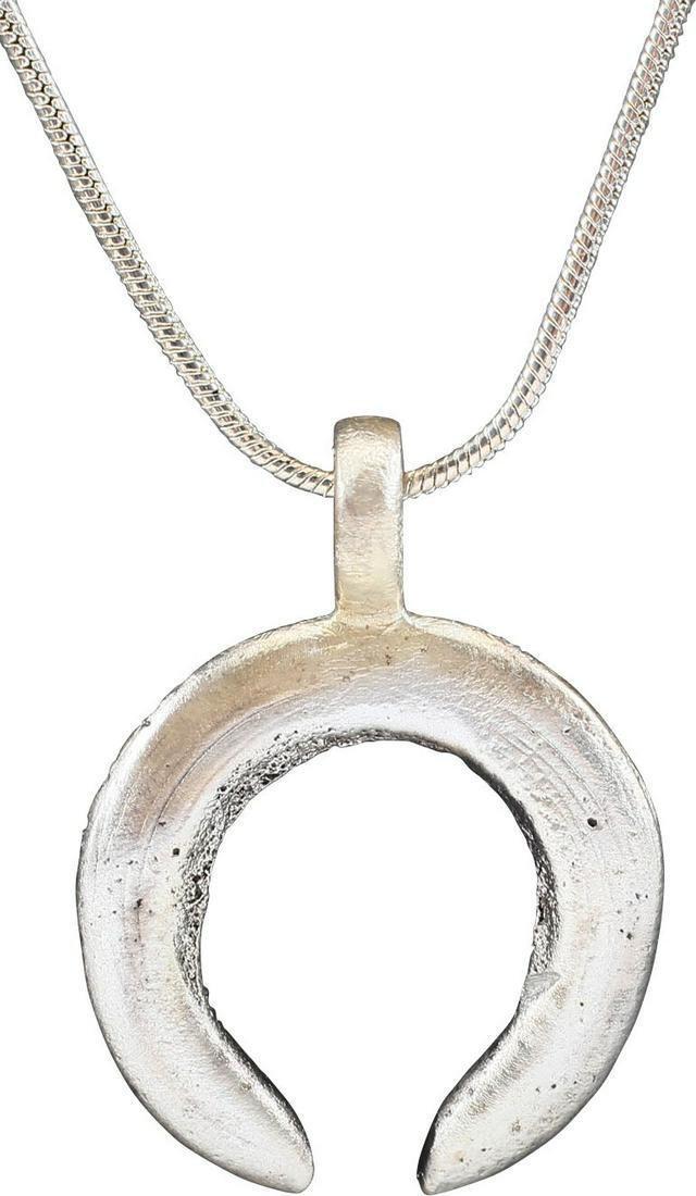 VIKING LUNAR PENDANT, C.870-1050: Cambridgeshire, England. Nearly and inch (0.93")" in width of opened circular form, tapered from the top to the terminals. Fundamental form to invoke supernatural guidance in navigating. Lightly textu