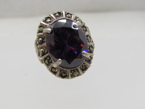 Vintage Sterling Silver Amethyst Marcasite Ring, Chunky, Sz. 7: Vintage Sterling Silver Amethyst Marcasite Ring, Chunky, Sz. 7. The stone is papx. 8.75 ctw or slightly larger. Excact measurement cannot be made due to setting. It is appx. 16+ by 13+ mm. There are m