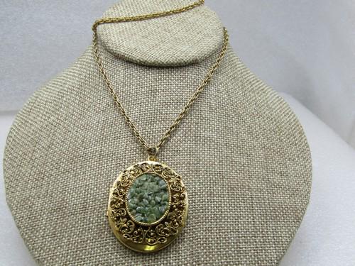 Vintage Green Agate Cluster Locket Necklace, 20", 1960's: Vintage Green Agate Cluster Locket Necklace, 20", 1960's. The locket is 1.75" tall with a filigree frame around the center 1" oval cluster of polished green agates. The locket is appx. 1.5" wide. It o