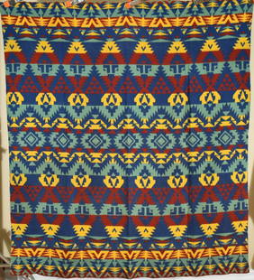 Vibrant 40's Esmond Camp Blanket, Indian Design: Cotton 30's/40's Esmond Mills (Esmond, RI) camp blanket, with deep blue, mustard, red and green colors and a graphic Native American Indian design. It measures 64" X 74" and is in very good, beefy