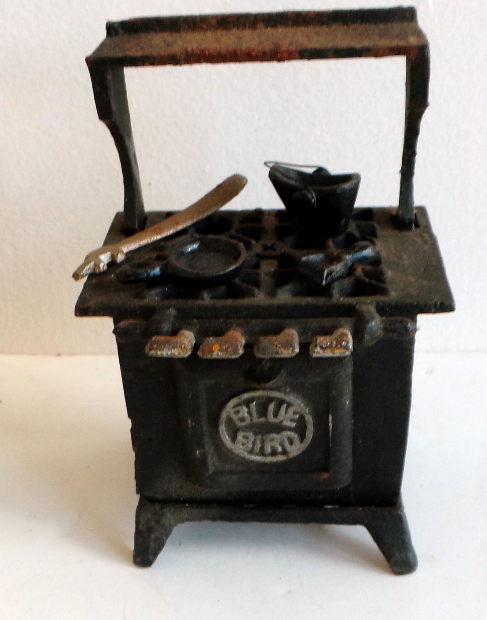 Cast Iron Stove With Accessories: Title: Cast iron stove with accessories Additional Info: Cast iron stove with accessories - Size: 5 1/2" H - Condition: good Shipping: Domestic: Flat-rate of $10.00 to anywhere within the contiguous U