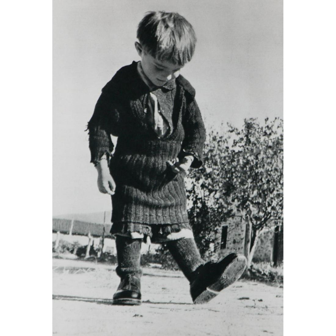 DAVID SEYMOUR - A little girl's first pair of shoes: Artist: DAVID SEYMOUR (Chim) Print Title: A little girl's first pair of shoes Medium: Sheet-fed Gravure Printing Date: 1960's Printed in the Netherlands Image Size approx: 8.5 x 6 inches David Seymour