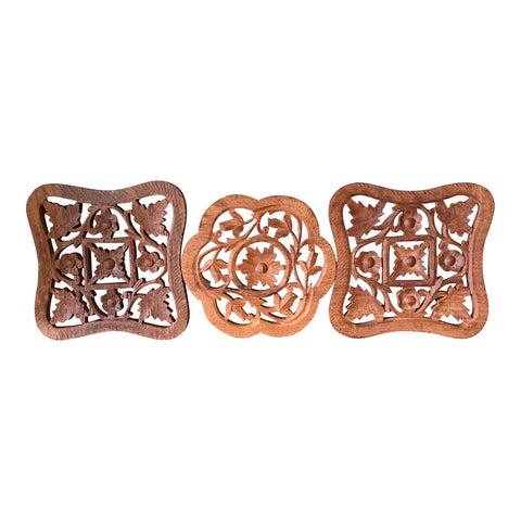 Hand-Carved Trivets - Set of 3: This gorgeous collection of handmade trivets are intricately carved in a floral pattern and are perfect for your dining table. They would also make beautiful wall hangings for the interior designer. D