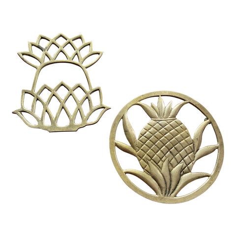 1970s Brass Pineapple Trivets - a Pair: Beautiful set of brass pineapple trivets. Perfect for the interior designer. DIMENSIONS 10ʺW × 10ʺD × 1ʺH STYLES Art Deco Arts & Crafts PERIOD 1970s