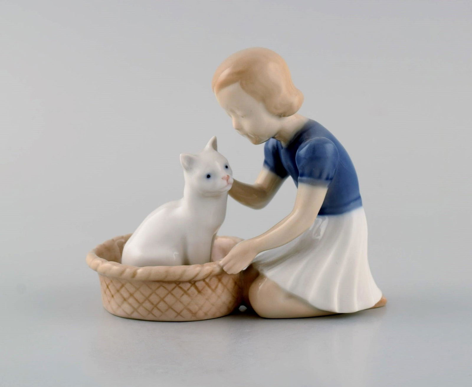 Claire Weiss for Bing & Grøndahl. Porcelain figure. Girl with cat. Model number 2249. Early: Claire Weiss for Bing & Grøndahl. Porcelain figure. Girl with cat. Model number 2249. Early 20th century. Measures: 11 x 10 cm. In excellent condition. Stamped. 1st factory quality. Reserve: $119