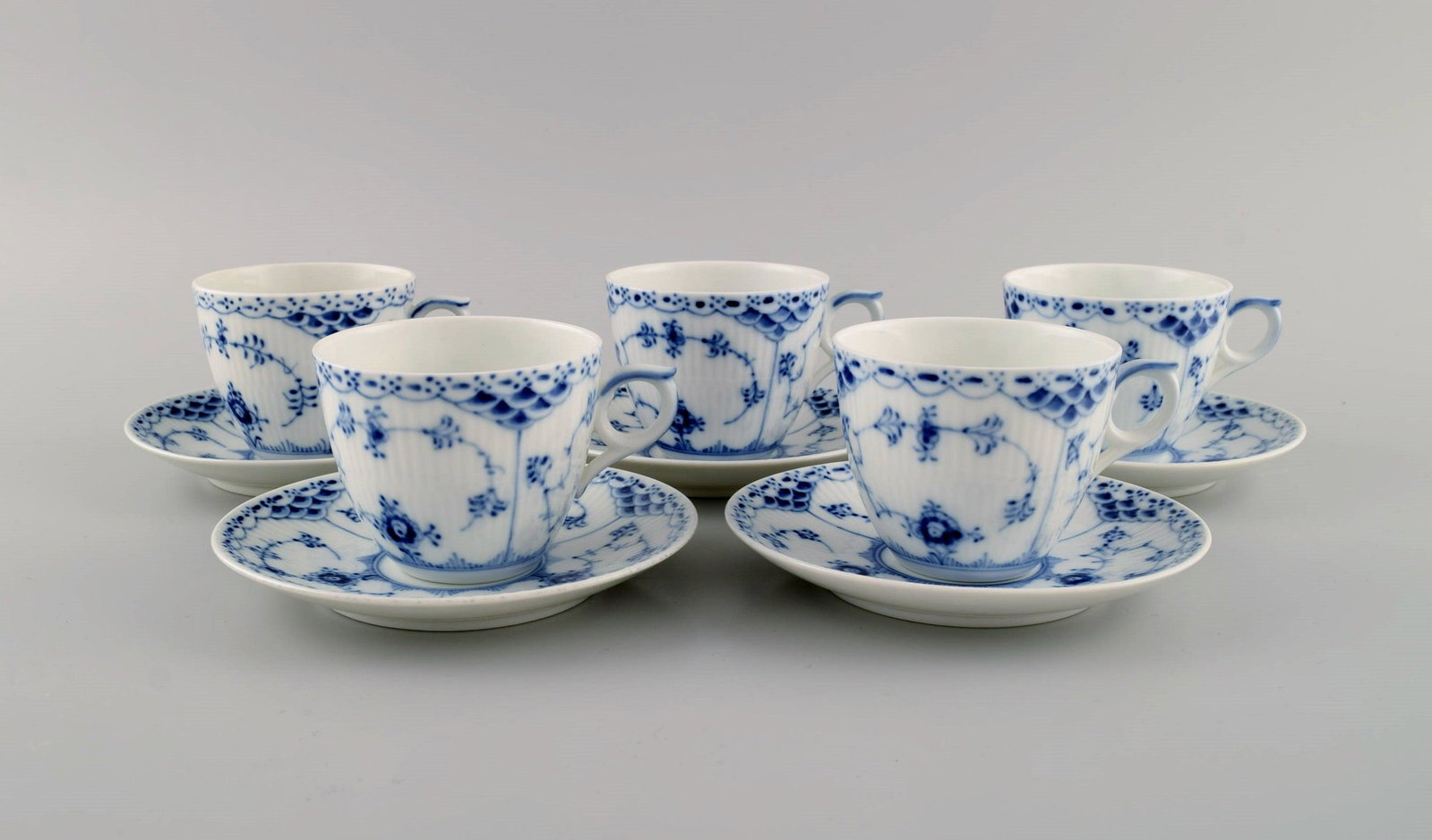 Five Royal Copenhagen Blue Fluted Half Lace coffee cups with saucers. Model number 1/756.: Five Royal Copenhagen Blue Fluted Half Lace coffee cups with saucers. Model number 1/756. The cup measures: 7.7 x 6.5 cm. Saucer diameter: 13.3 cm. In excellent condition. Stamped. 1st factory quality