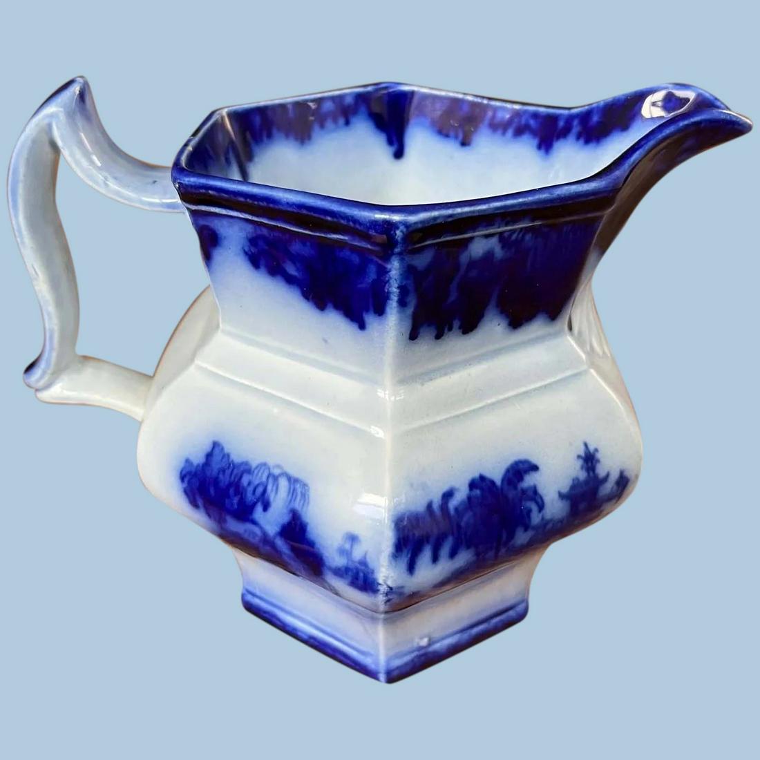 19th C. Flow Blue Pitcher: Title: 19th C. Flow Blue Pitcher Description: This is a flow blue pitcher in great shape. Made in a typical Victorian style, it appears to be mid-century - roughly 1850s or 60s. The maker and pattern