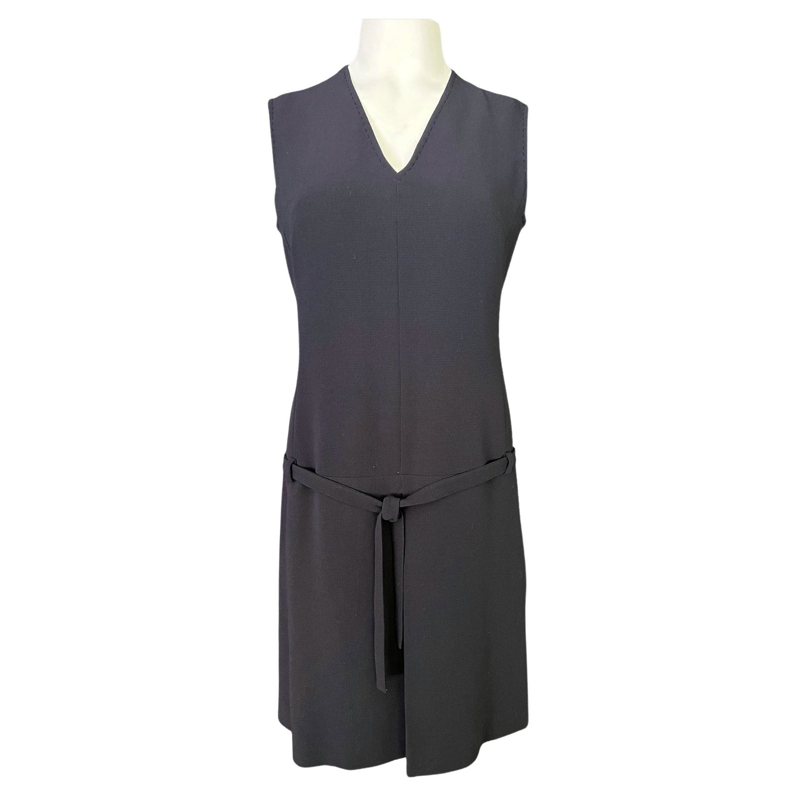 Max Mara Navy Wool Mini Dress, Size 6: V neckline - Sleeveless style - Mini length - Detailed with belt - Concealed rear zip closure - Rear lit detail - Made in Italy Details Dimensions Length: 37 in. (93.98 cm)Marked Size: 6 (US)Bust: 36
