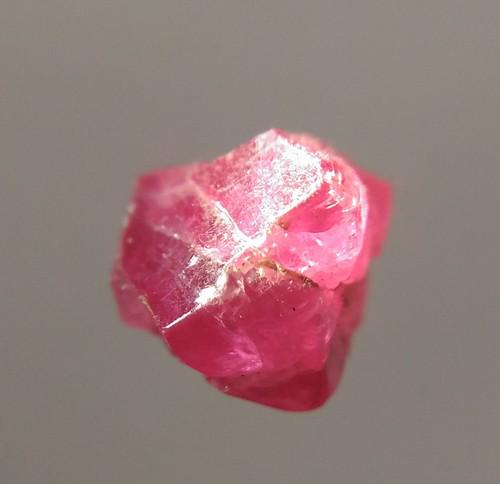 1.75 CT RED SPINEL - UNTREATED GEMSTONE: Title: 1.75 CT RED SPINEL - UNTREATED GEMSTONE Origin: Mogok Township, Mandalay Region, Myanmar Size: 0.63x0.48x0.44 cm / 0.21 gram Description: red spinel with some crystalline faces. naturally etche