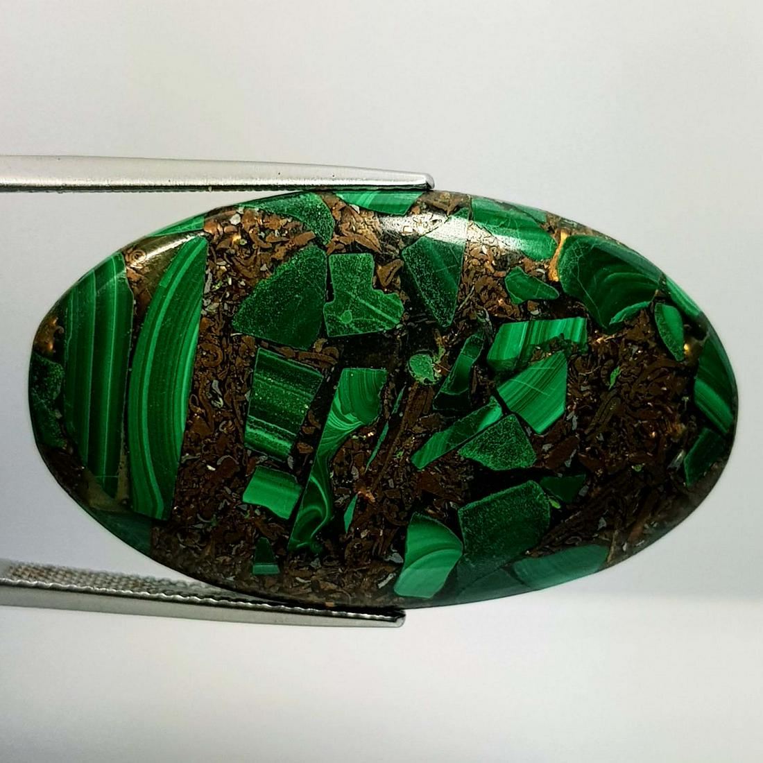 48.83 Ctz Fine Gem Composite Malachite: No Reserve! Title: 48.83 Ctz Fine Gem Composite Malachite Color/Clarity: Green / Opaque Gemstones: Malachite Carat Weights: 48.83 Size/Dimensions: 39.60 x 25.25 x 4.80 Additional Information: Oval / A