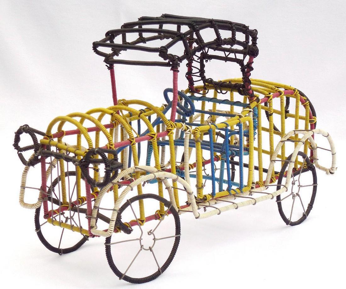 Detailed and colorful Folk Art car by Clifton Eugene: Title: Detailed and colorful Folk Art car by Clifton Eugene Dale Provenance/Additional Info: This is a very detailed and colorful car with red, black, white, yellow, and blue wires. It was made from c