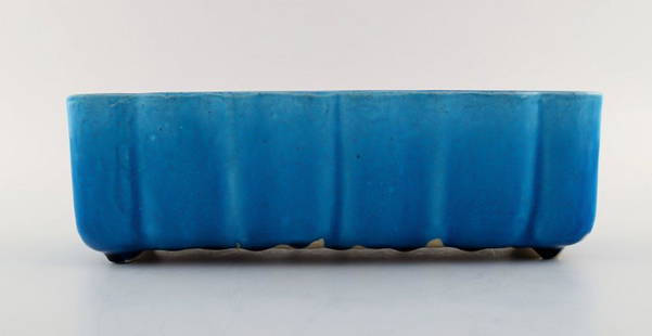 Nils Kähler for Kähler, Denmark. Glazed flower basin / jardiniere in beautiful blue glaze.: Nils Kähler for Kähler, Denmark. Glazed flower basin / jardiniere in beautiful blue glaze. 1960 / 70's. Measures: 27 x 10 x 8,5 cm. Stamped. In very good condition. Reserve: $294.00 Shipping