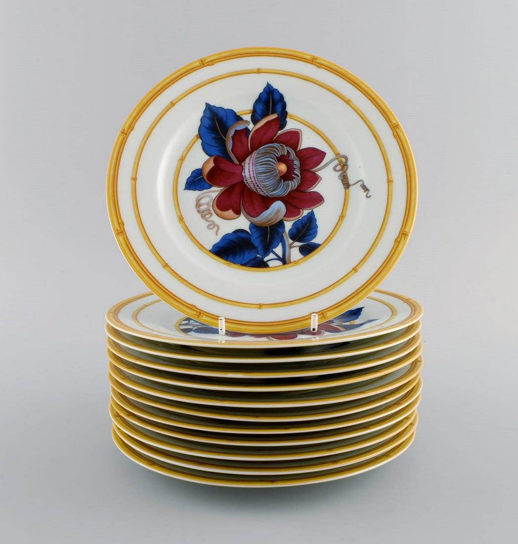 Porcelain of Paris. "Tropical Aurore". 12 porcelain lunch plates decorated with flowers and bamboo. (1 of 4)