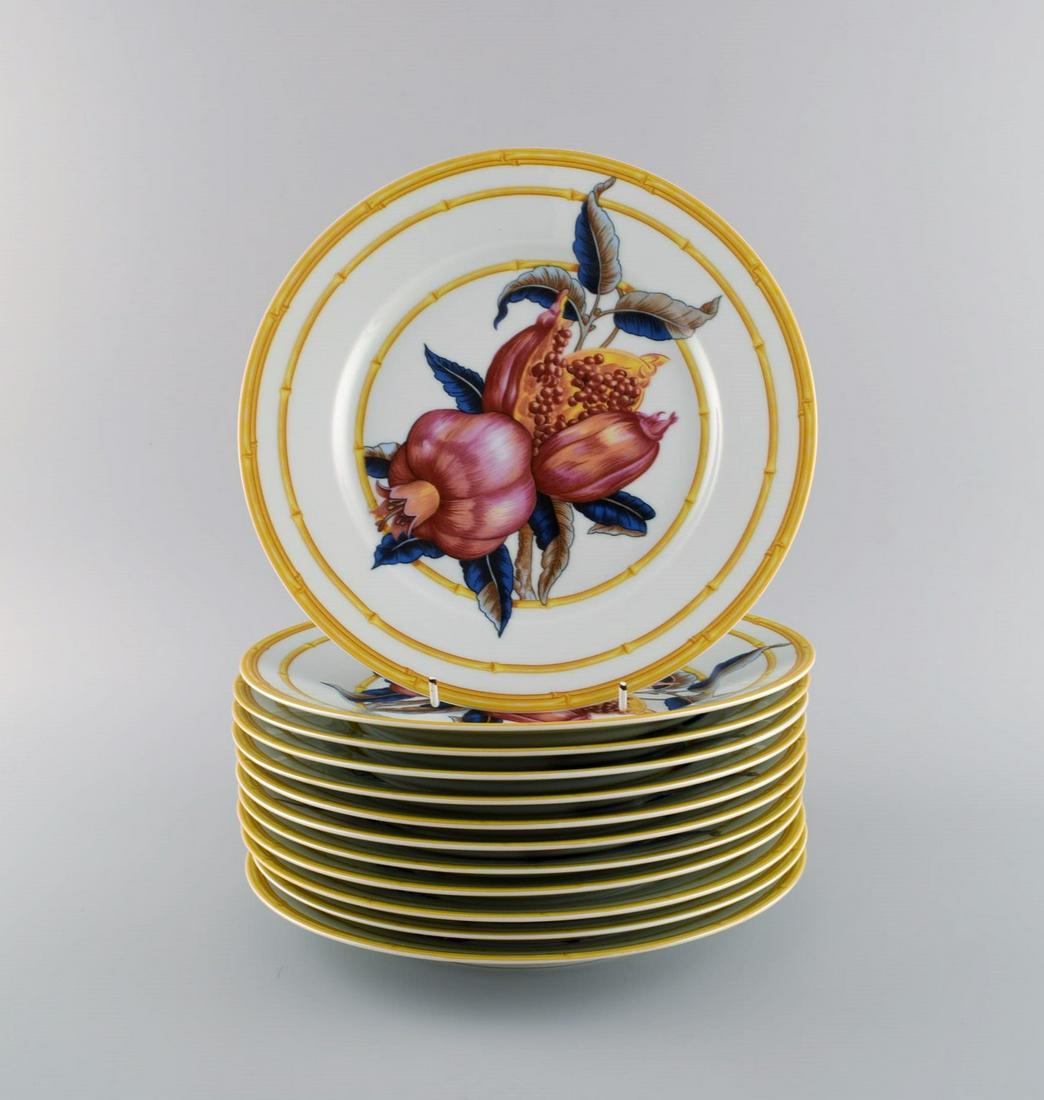 Porcelaine de Paris. "Aurore Tropicale". Twelve porcelain dinner plates decorated with pomegranates (1 of 4)