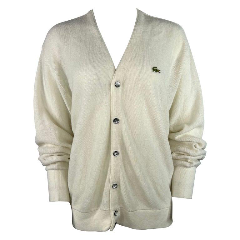 Lacoste White Cardigan Sweater, Size Large: Product details: The sweater features v neck line and front button closure with front side logo detail. Designer Lacoste Dimensions Length: 26 in. (66.04 cm)Marked Size: Large (US)Bust: 44 in. (111.76