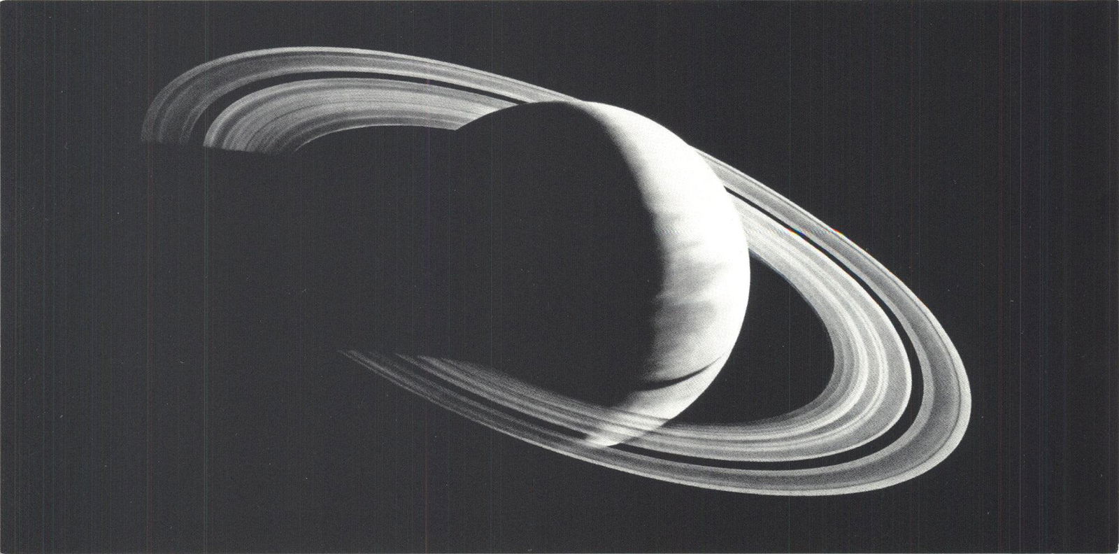 Robert Longo - Untitled (Saturn) - 2006 Offset Lithograph 3.75" x 7.25": Untitled (Saturn) by Robert Longo, 2006 Unsigned Offset Lithograph. Paper size is 3.75 x 7.25 inches, with an image size of 3.75 x 7.25 inches. The Offset Lithograph is from an unknown edition size. a