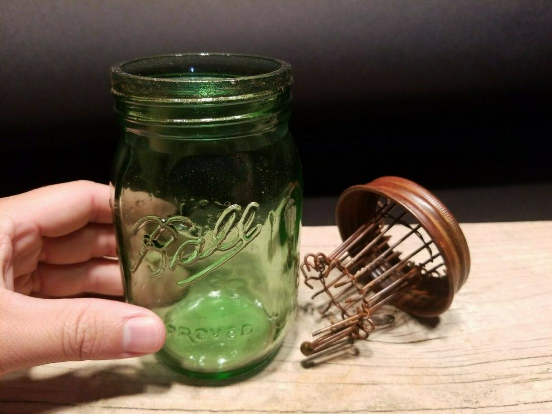 Green Ball Jar Glass Mouse Trap: 5 1/4" High jar x 3" Wide Great reproduction of a glass mouse trap. As you can see the heavy glass jar has a metal top with an internal trap door causing the mouse to become trapped on the inside of t