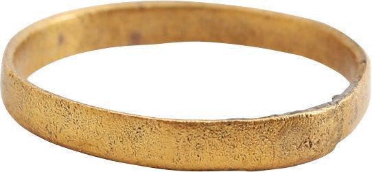 VIKING WEDDING RING, 10TH-11TH CENTURY AD, SIZE 2 1/2: Size 2 1/2 for the small finger as was the custom. Gilt bronze. 1.8mm width. Surface lightly textured from burial. Professionally refurbished with the 24karat gold overlay restored. See the reference