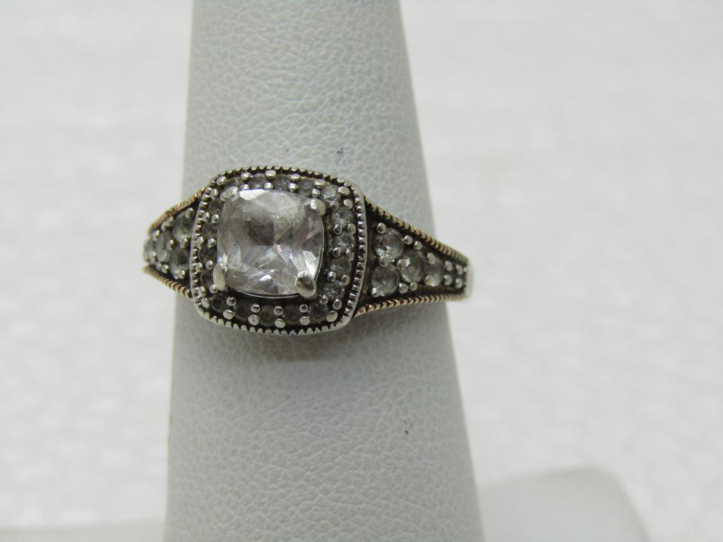 Vintage 10kt Moissanite/White Sapphire Halo Ring, Sz. 7, Signed JWBR: Vintage 10kt Moissanite/White Sapphire Halo Ring, Sz. 7, Signed JWBR, White Gold, Appx. 1 CT main stone with 28 small moissonaite or white sapphires in the halo and down the shoulders of the ring. The