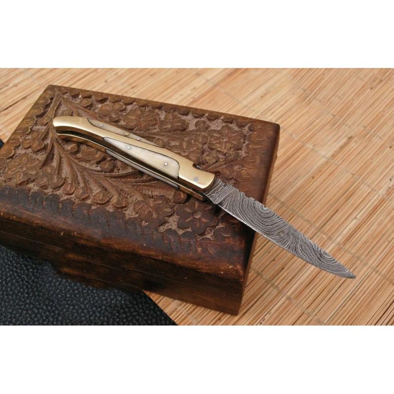 Handmade folding pocket work damascus steel knife bone: Blade - damask steel Handle – bone, brass bolsters Leather sheath – not included Blade hardness – 55-58 HRC Total length – 6,25 (inch) Blade length - 3 (inch) Blade Thickness &