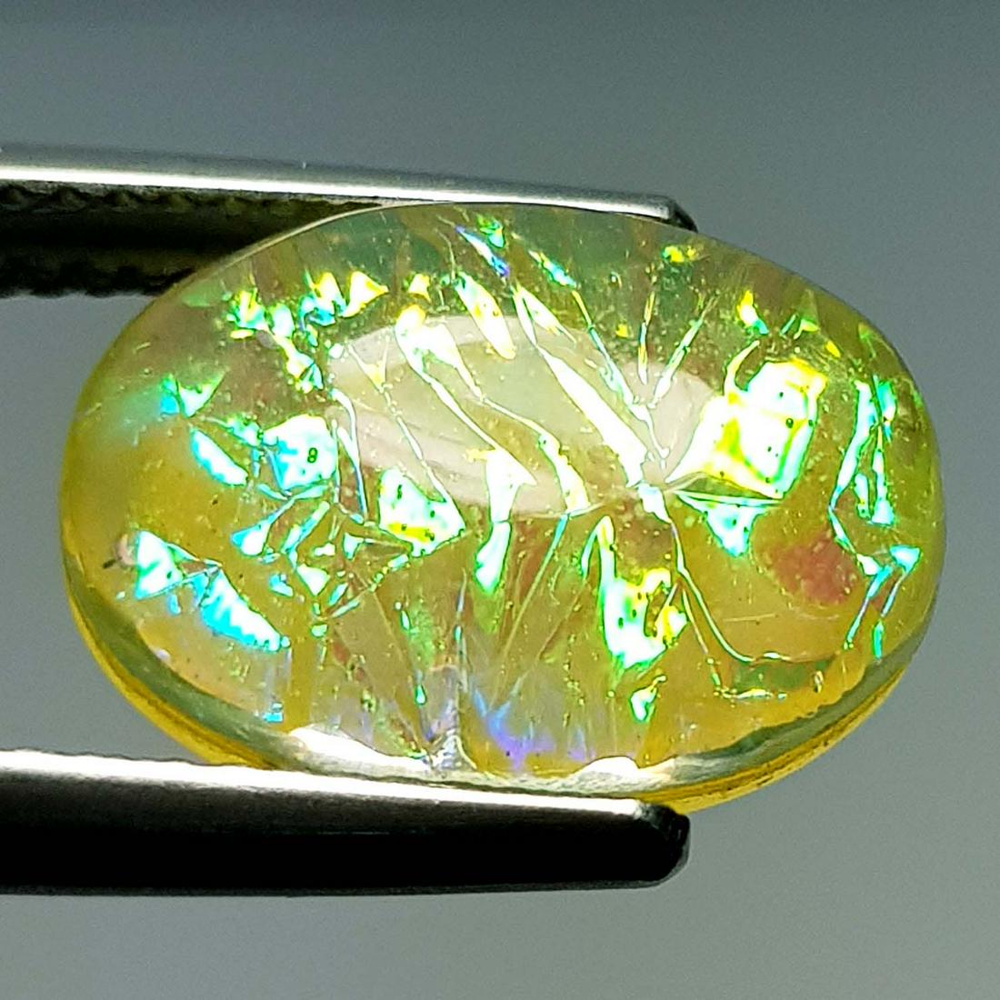 5.93 Ctz Australian Doublet Opal: No Reserve! Title: 5.93 Ctz Australian Doublet Opal Color/Clarity: Play of colors/ Trasparent Gemstones: Opal Carat Weights: 5.93 Size/Dimensions: 13.90 x 10.00 x 5.50 Additional Information: Oval / A