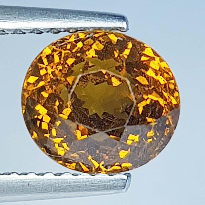 1.64Ctz Natural Mali Garnet: No Reserve! Title: 1.64Ctz Natural Mali Garnet Color/Clarity: Brownish Yellow / VVS Gemstones: Garnet Carat Weights: 1.64 Size/Dimensions: 7.50 x 5.60 x 4.70 Additional Information: Oval / Mali Shippi