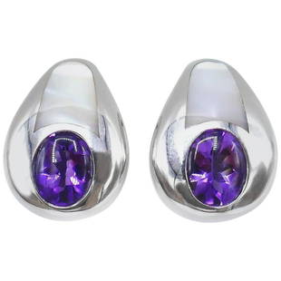 Mauboussin Vintage White Gold Amethyst Mother of Pearl Earrings: Title: Mauboussin Vintage White Gold Amethyst Mother of Pearl Earrings Description: Vintage clip-on earrings by Mauboussin made of 18k white gold featuring amethyst and mother of pearl. Stamped with t