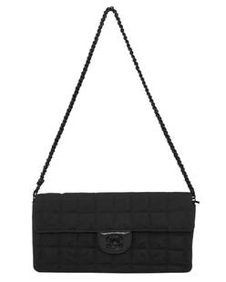 Chanel 2000s Black Nylon Travel East West Bag: Super chic Chanel Travel East-West bag from the early 2000s. Black quilted nylon with the interlocking CC logo trademark print throughout the nylon. Black leather surrounding the twist lock with a