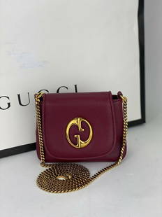 GUCCI Womans Bag 1973 Wine Pebbled Calfskin Leather Mini Chain Shoulder Bag B314: SKU B314 0421 Pre-Owned 100% Authentic Gucci 1973 Wine Pebbled calfskin Mini chain Bag RATING: B..very good, well maintained, shows minor signs of wear MATERIAL: calfskin leather HANDLE: attached