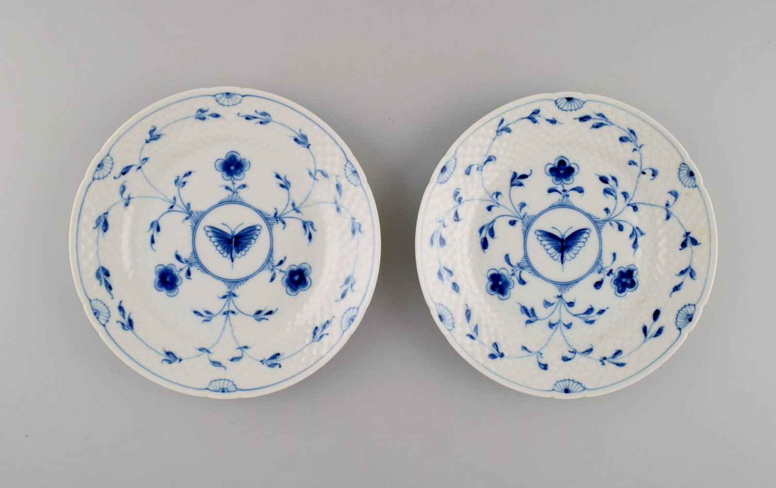 Bing & Grøndahl / B&G, Butterfly. Two plates in hand-painted porcelain. Model number 27. Mid: Bing & Grøndahl / B&G, Butterfly. Two plates in hand-painted porcelain. Model number 27. Mid 20th century. Diameter: 19.5 cm. In excellent condition. Stamped. 1st factory quality. Reserve: $119.0
