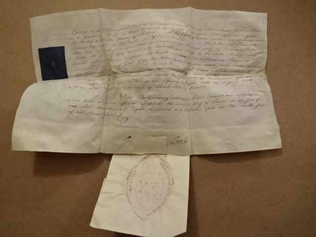 1813 English Vellum Manuscript Signed Bishop of Exeter: Legal document on vellum pertaining to the deathe of a James Parkin, Clerk of the Church, signed by the Bishop of Exeter. Blue revenue stamp, and large embossed handing seal.of the Church. Very Good,