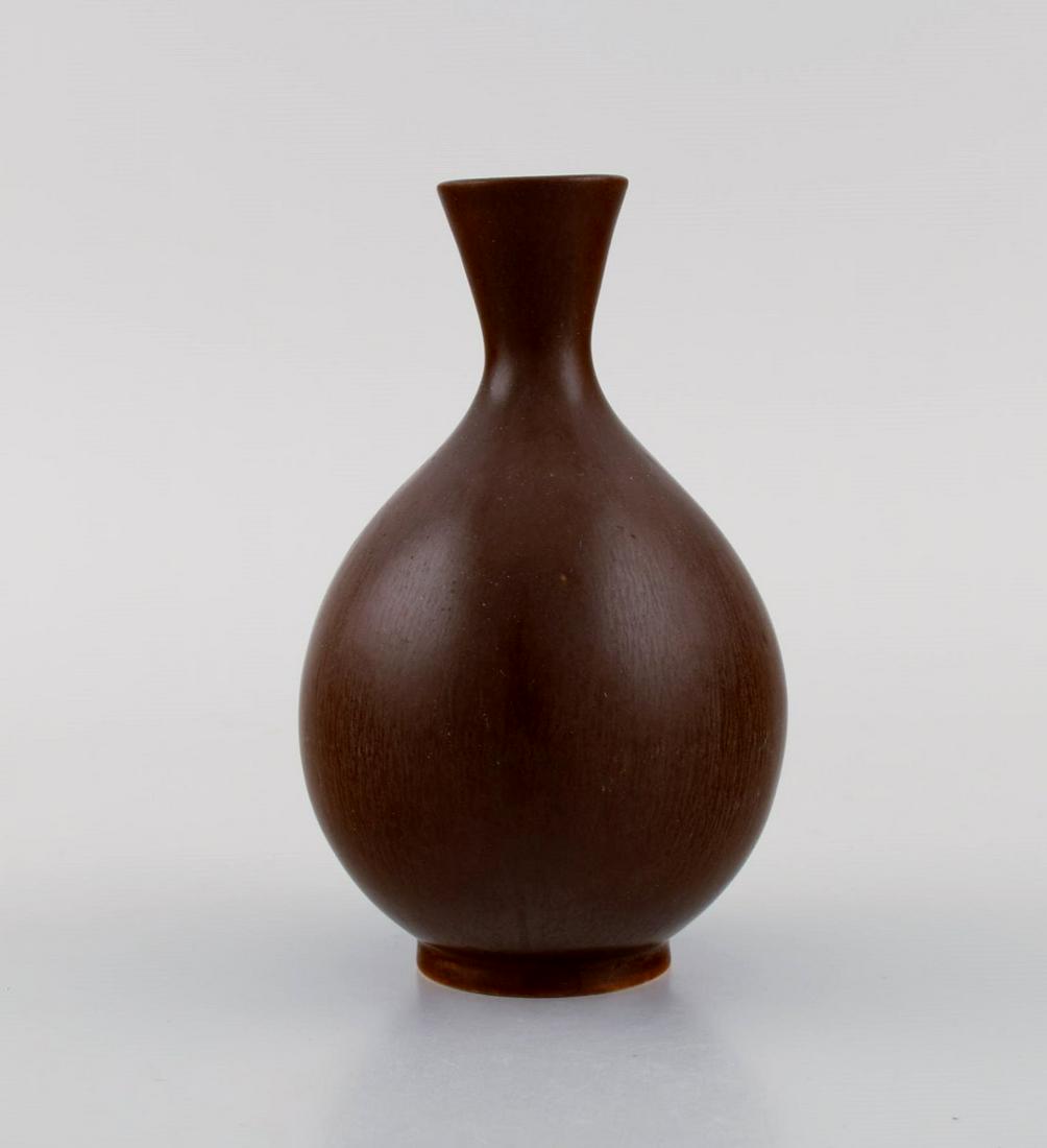 Berndt Friberg (1899-1981) for Gustavsberg Studiohand. Vase in glazed stoneware. Beautiful glaze in: Berndt Friberg (1899-1981) for Gustavsberg Studiohand. Vase in glazed stoneware. Beautiful glaze in brown shades. 1960s. Measures: 13.3 x 9.5 cm. In excellent condition. Stamped. Reserve: $189.00 Ship