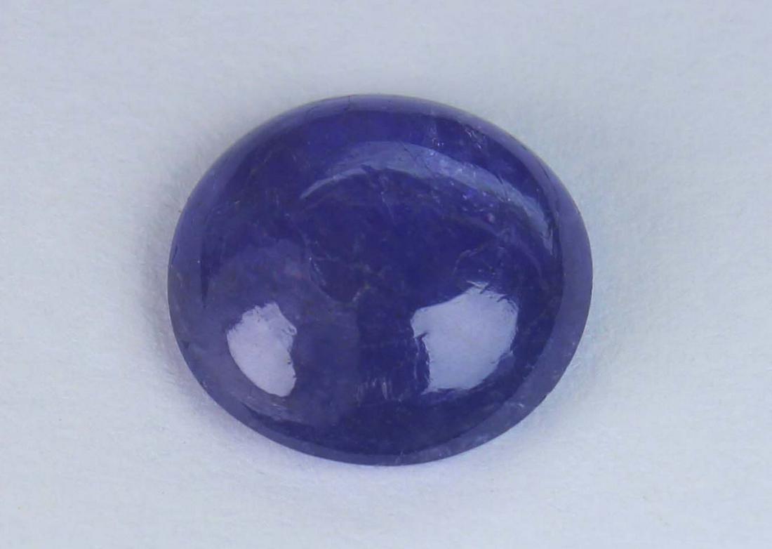 3.04 Cts Natural Tanzanite: No Reserve! Title: 3.04 Cts Natural Tanzanite Gemstone : Natural Tanzanite Shape and cut : Round Cabochan Weight : 3.04 Carats Measurements : 9.71-9.52x3.73 mm Color : Violet Transprancy : Transparent