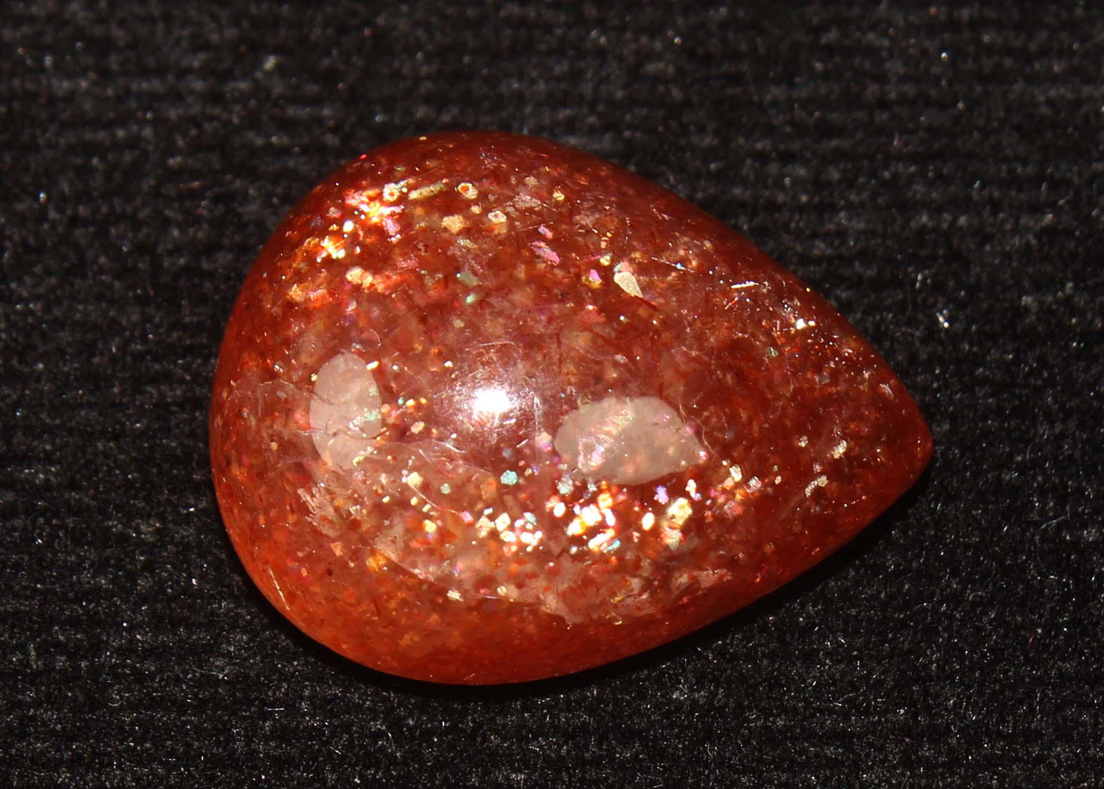 15.53 Cts Natural Sunstone: No Reserve! Title: 15.53 Cts Natural Sunstone Gemstone : Natural Sunstone Origin : Africa Weight : 15.53 Carats Dimensions : 19.43x15.41x7.98 mm Shape : Pear Cabochon Color : Orange Treatment : No Tre