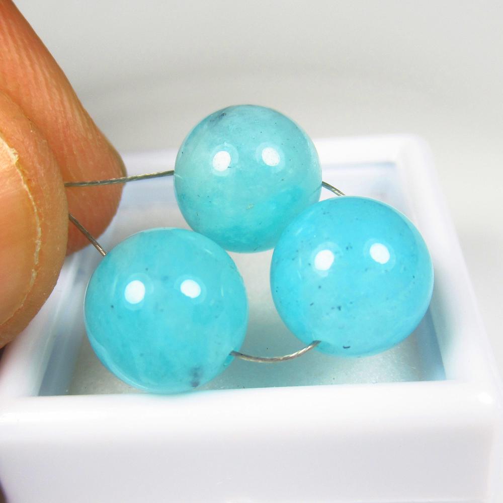 Natural Amazonite Beads - 16.11 Ct: No Reserve! Title: Natural Amazonite Beads - 16.11 Ct Origin: Brazil Carat Weight: 16.11 Size/Dimensions: 9.5 x 9.5 mm Additional Information: Pieces : 3 No's / Shape : Round Drilled / Color : Blue /