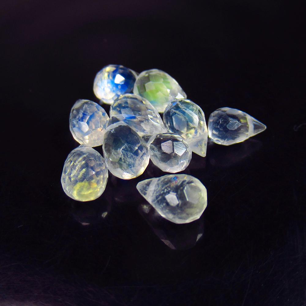 7.81 Ctw Natural 10 Blue Moonstone Pear Drop Beads: No Reserve! Title: 7.81 Ctw Natural 10 Blue Moonstone Pear Drop Beads Clarity: Translucent Gemstone: Natural Moonstone Beads Carat Weight: 7.81 Size/Dimensions: 6.0x4.0 - 7.3x4.4 mm / 10 Pc's Addition