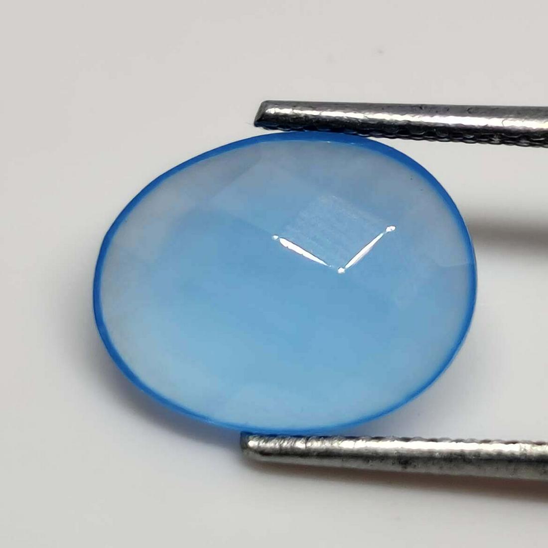 2.00 ct Natural Faceted Blue Chalcedony: No Reserve! Title: 2.00 ct Natural Faceted Blue Chalcedony Description: Gemstones: Chalcedony Carat Weights: 2.00 ct Size/Dimensions: 11 X 9 X 3 mm Gemstone: Chalcedony Shipping: Domestic: Flat-ra