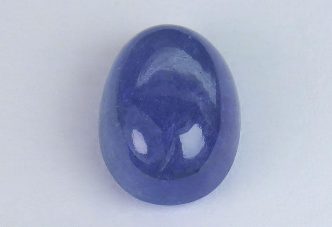 4.40 Cts Natural Tanzanite: No Reserve! Title: 4.40 Cts Natural Tanzanite Gemstone : Natural Tanzanite Shape and cut : Oval Cabochan Weight : 4.40 Carats Measurements : 10.75x7.92x5.23 mm Color : Violet Transprancy : Transparent