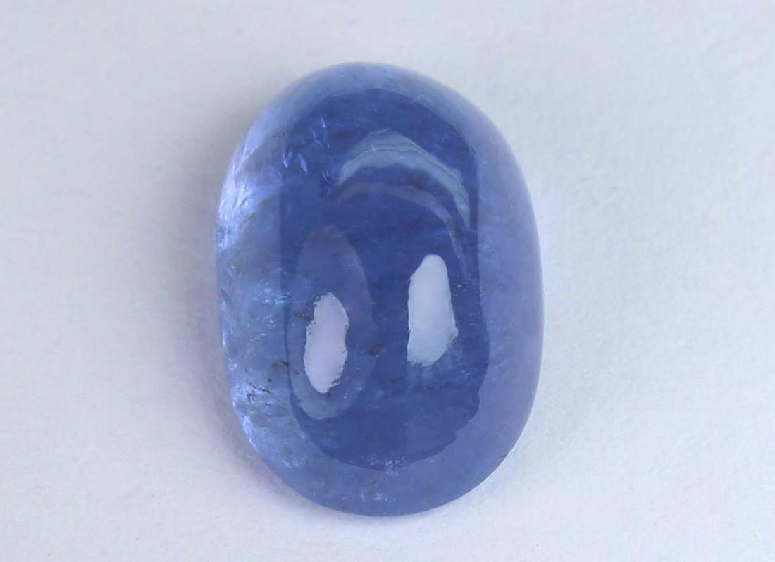 4.78 Cts Natural Tanzanite: No Reserve! Title: 4.78 Cts Natural Tanzanite Gemstone : Natural Tanzanite Shape and cut : Oval Cabochan Weight : 4.78 Carats Measurements : 12x8 mm Color : Violet Transprancy : Transparent Treatment 
