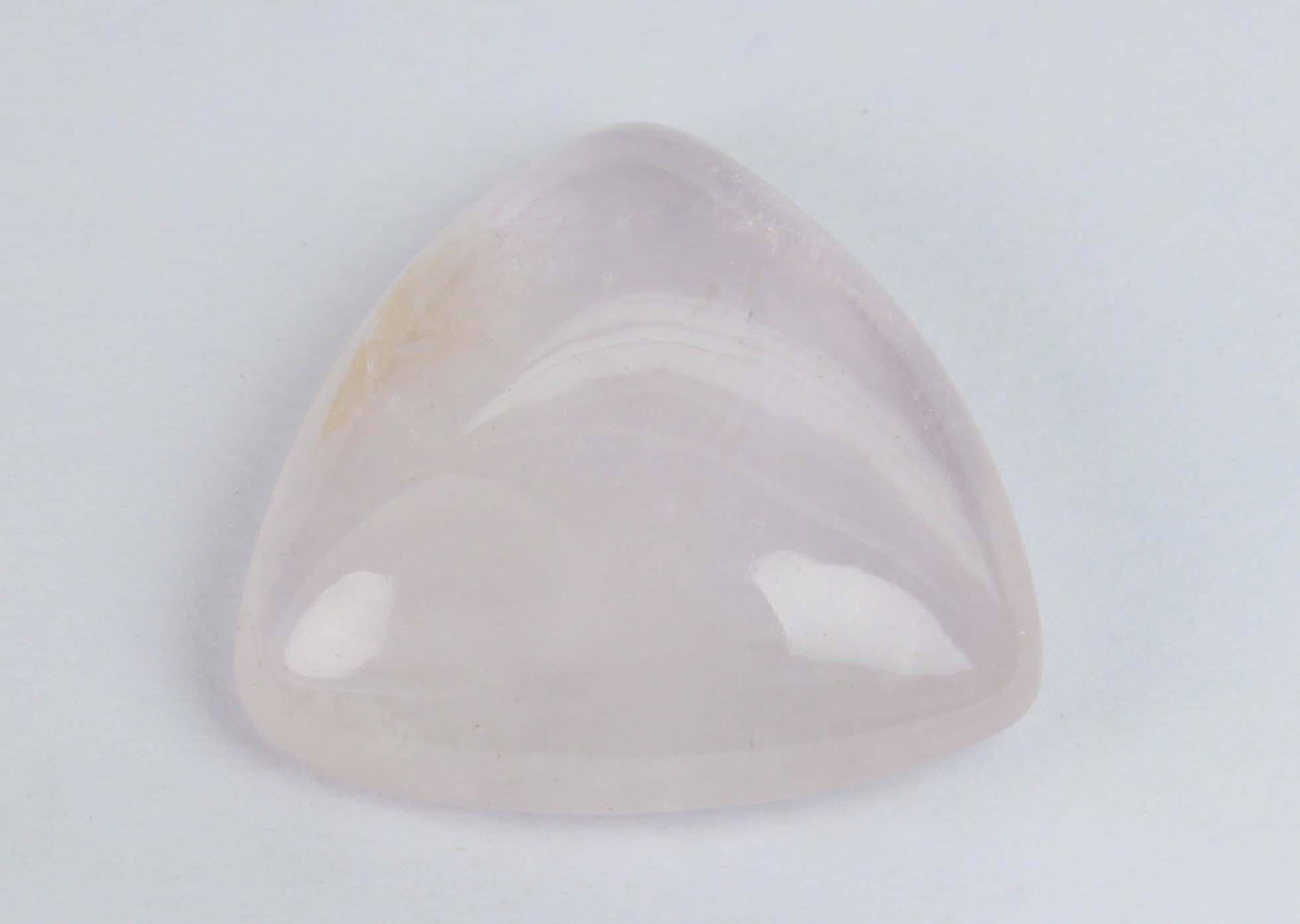 12.51 Cts Natural Morganite: No Reserve! Title: 12.51 Cts Natural Morganite Gemstone : Natural Morganite Shape and Cut : Trillion Cabochon Weight : 12.51 carats Measurements : 17x17 mm Color : Peach Transparency : Transparent Tre