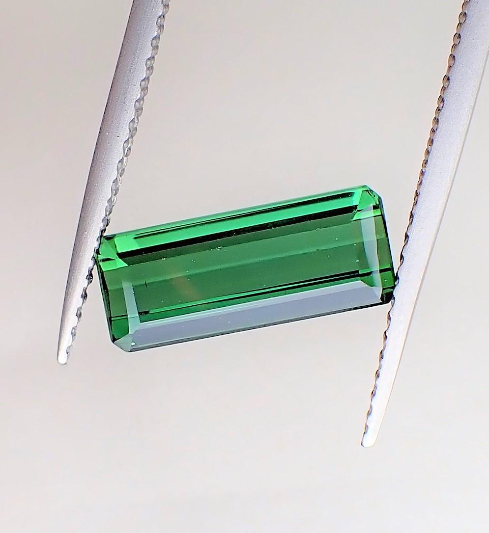Green Tourmaline - 2.20 ct: Title: Green Tourmaline - 2.20 ct Description: Natural Gemstone: Tourmaline Carat Weight: 2.20 ct Size/Dimensions: 11.80 x 4.70 x 3.40 mm Additional Information: Natural Green Tourmaline faceted recta