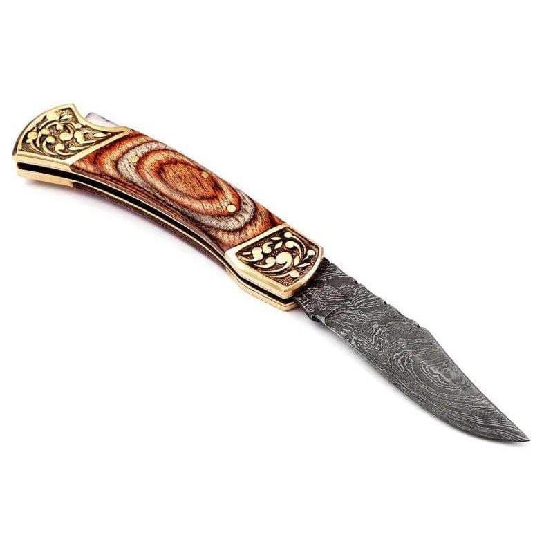 Everyday carry folding pocket damascus steel knife wood: Blade - damask steel Handle – wood, brass bolster Leather sheath – included Blade hardness – 55-58 HRC Total length – 7,75 (inch) Blade length - 3,75 (inch) Blade Thickness 
