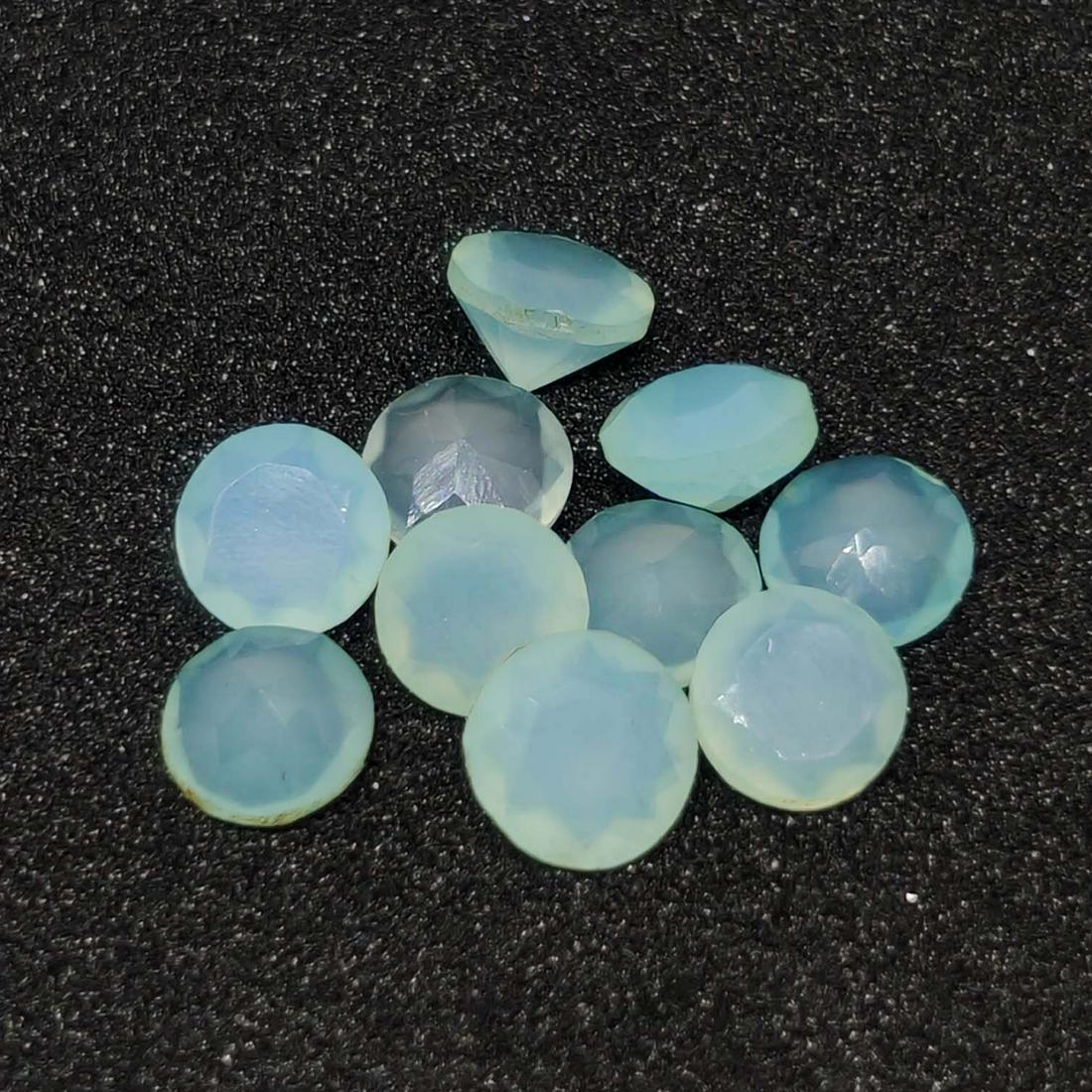 4.25 ct Natural Aqua Chalcedony Faceted Lot: No Reserve! Title: 4.25 ct Natural Aqua Chalcedony Faceted Lot Additional Information: Gemstones: Chalcedony Carat Weights: 4.25 ct Size/Dimensions: 5 X 5 mm Materials & Techniques: Chalcedony Shippin