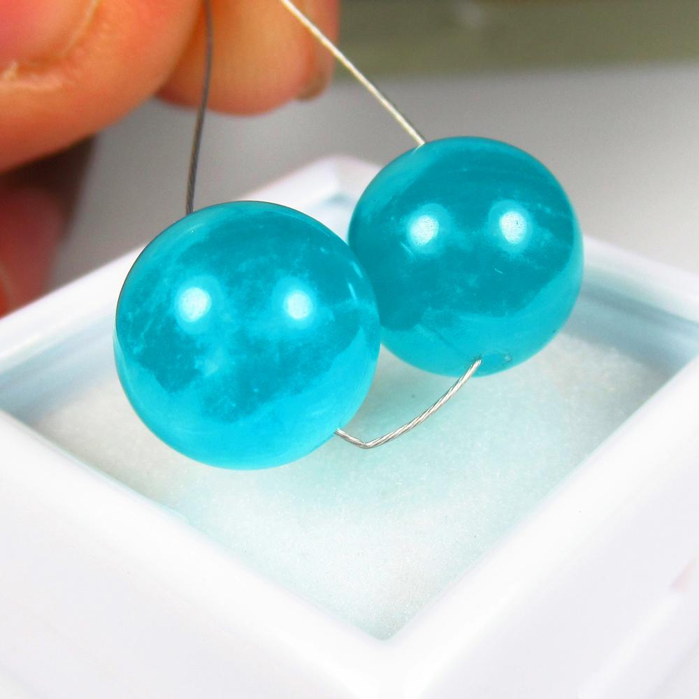 Natural Amazonite Beads - 13.19 Ct: No Reserve! Title: Natural Amazonite Beads - 13.19 Ct Origin: Brazil Weight: 13.19 Size/Dimensions: 10.3 x 10.3 mm Additional Information: Pieces : 2 No's / Shape : Round Drilled / Color : Blue / Clar