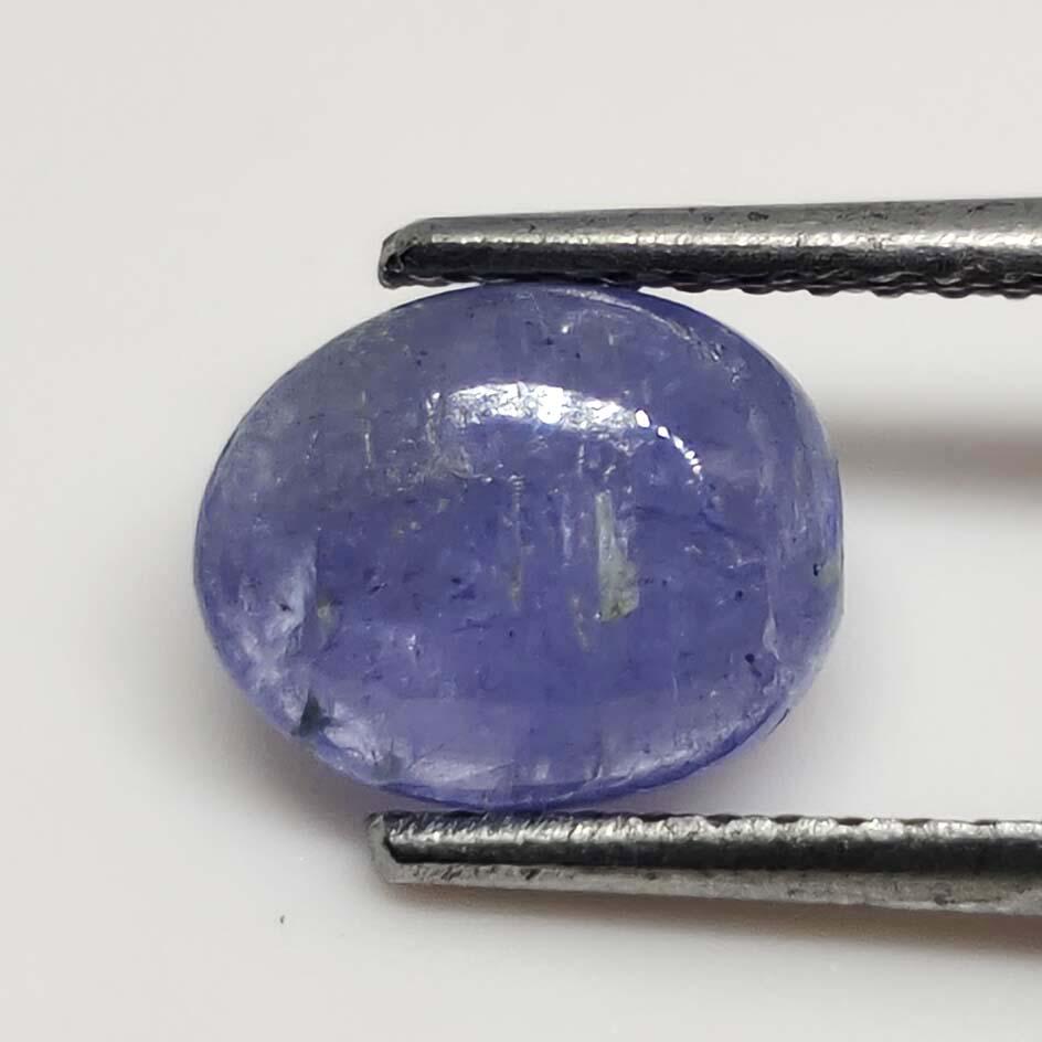 1.45 ct Natural Tanzanite Cab: No Reserve! Title: 1.45 ct Natural Tanzanite Cab Additional Information: Gemstones: Tanzanite Carat Weights: 1.45 ct Size/Dimensions: 8 x 6 X 3 mm Origin : Tanzania Materials & Techniques: Tanzanite,S