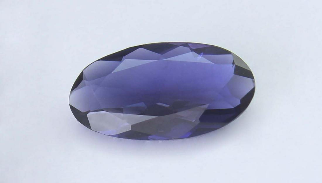 1.84 Cts Natural Iolite: No Reserve! Title: 1.84 Cts Natural Iolite Additional Information: Gemstone : Natural Iolite Shape and cut : Oval Cut Weight : 1.84 Carats Measurements : 13x7 mm Clor : voiLight Transprancy : Transpar