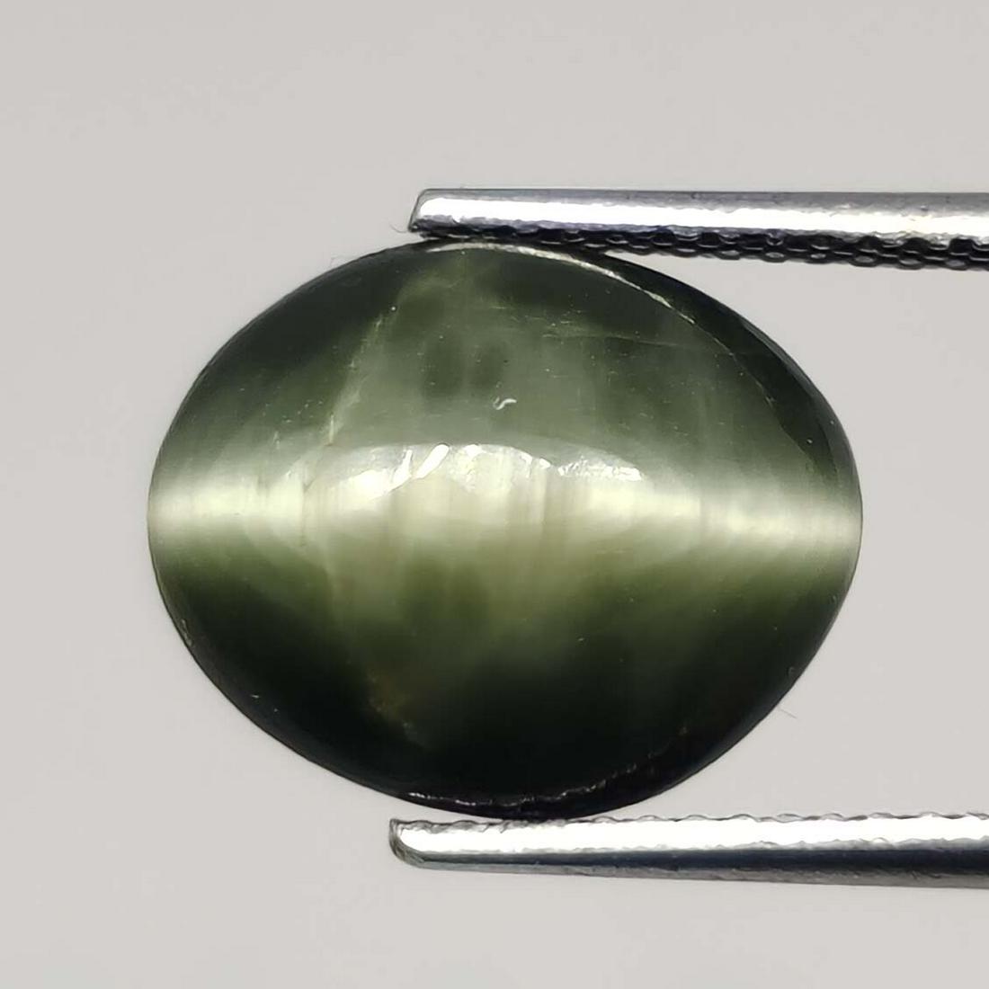 5.40 ct Natural Cat's Eye: No Reserve! Title: 5.40 ct Natural Cat's Eye Additional Information: Gemstones: Natural Cat's Eye Carat Weights: 5.40 ct Size/Dimensions: 12 X 10 X 6 mm Treatment: Colorless Oil Materials & Techniques