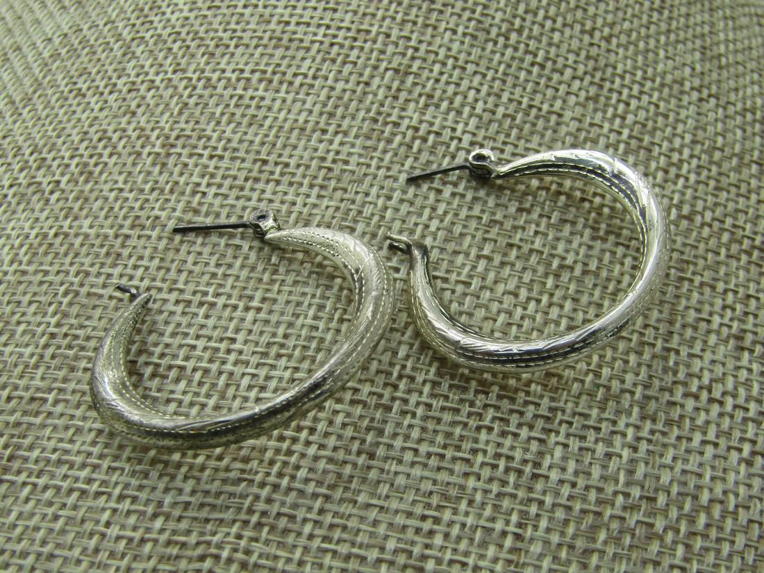 Vintage Sterling Wide Engraved Pierced Earrings, 1": Vintage Sterling Wide Engraved Pierced Earrings, 1" and 1-3/8" wide. Weight is appx. 5.13 grams. Marked .925 and tested. Not signe by themaker. 1960's-1970's. Good condition with some oxidation that w