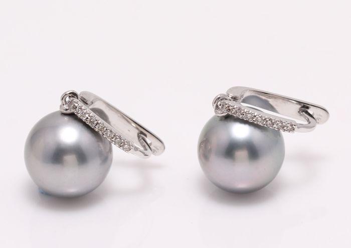 14 kt. White Gold - 11x12mm Round Tahitian Pearls - Earrings - 0.11 ct: Title: 14 kt. White Gold - 11x12mm Round Tahitian Pearls - Earrings - 0.11 ct Description: Emerging from the tropical lagoons of French Polynesia, these pearls have a beautiful natural grey-green colo